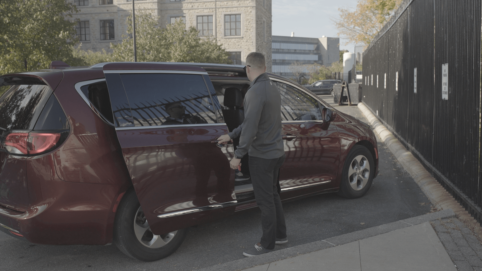 Guide helping guests out of van